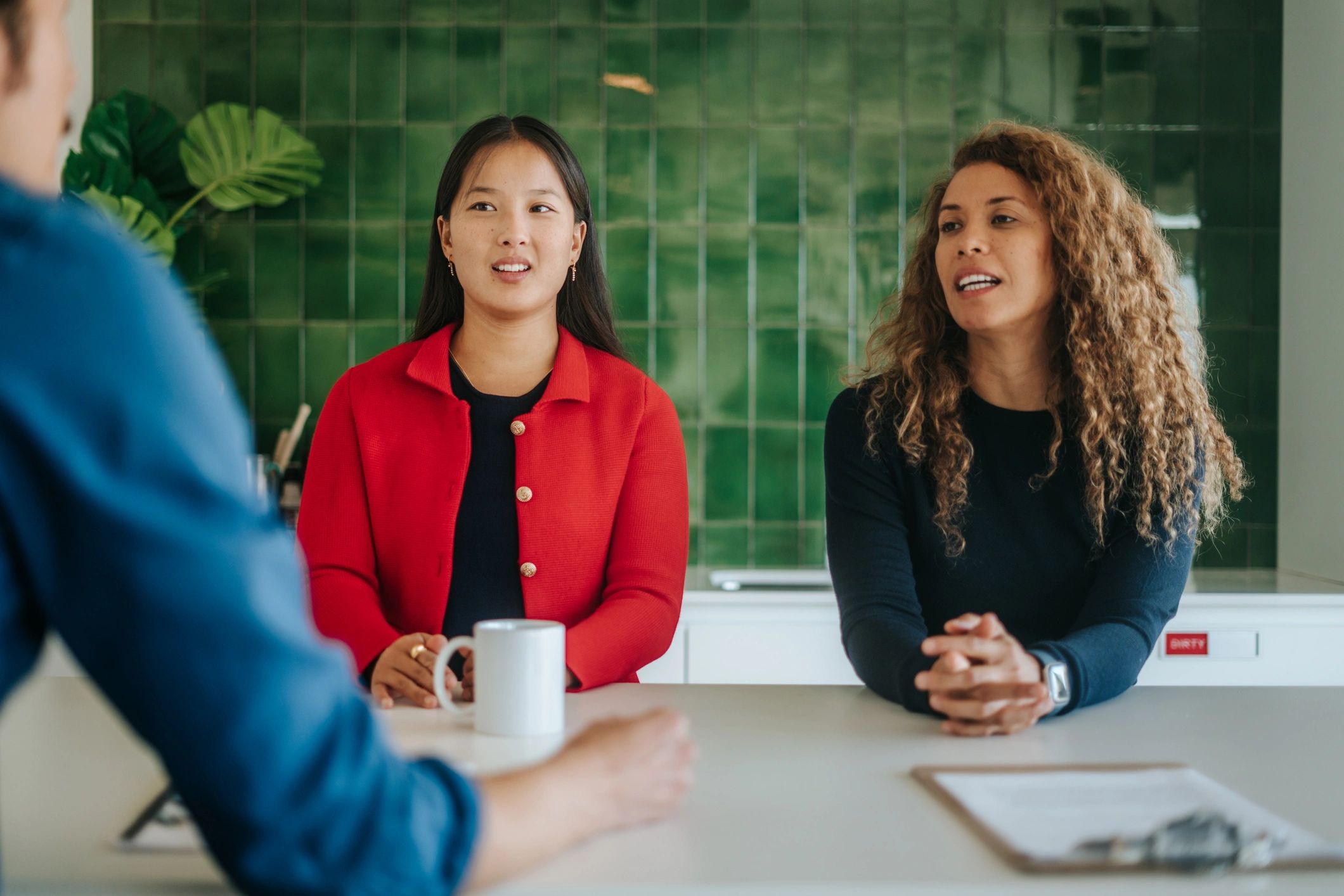 Consultants meeting with clients in a professional office