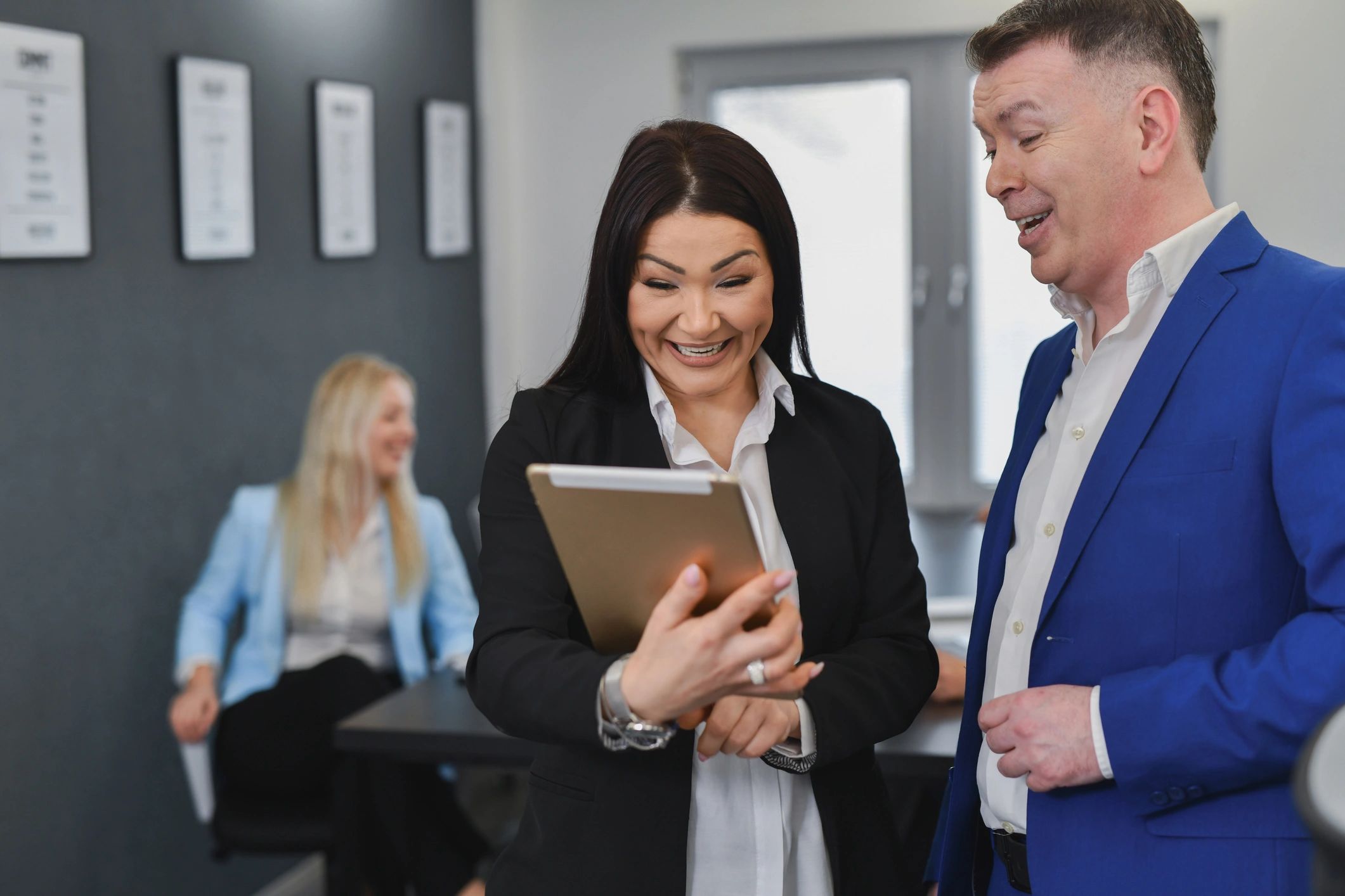 Professional consultants reviewing client information together in an office